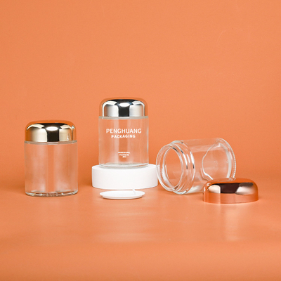 Round 100g Capsule Glass Container With Rose Golden Cap Sliver Cap Glass Jar Packaing